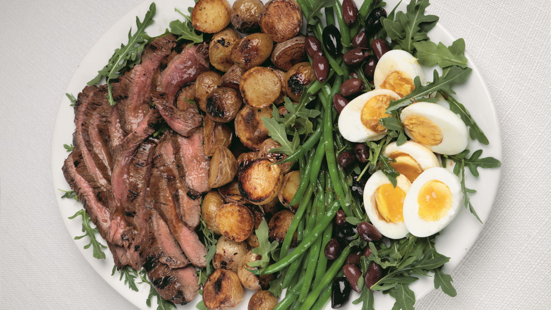 Grilled flank steak and potato salad nicoise