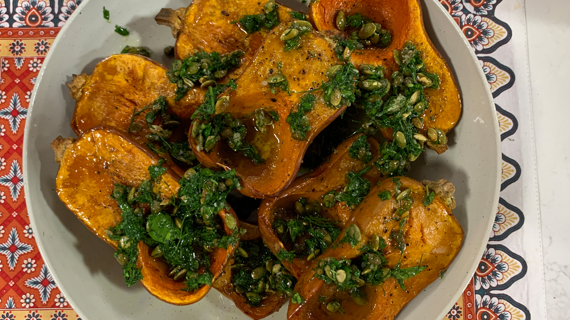 Roasted honey nut squash with a caper and pumpkin seed gremolata