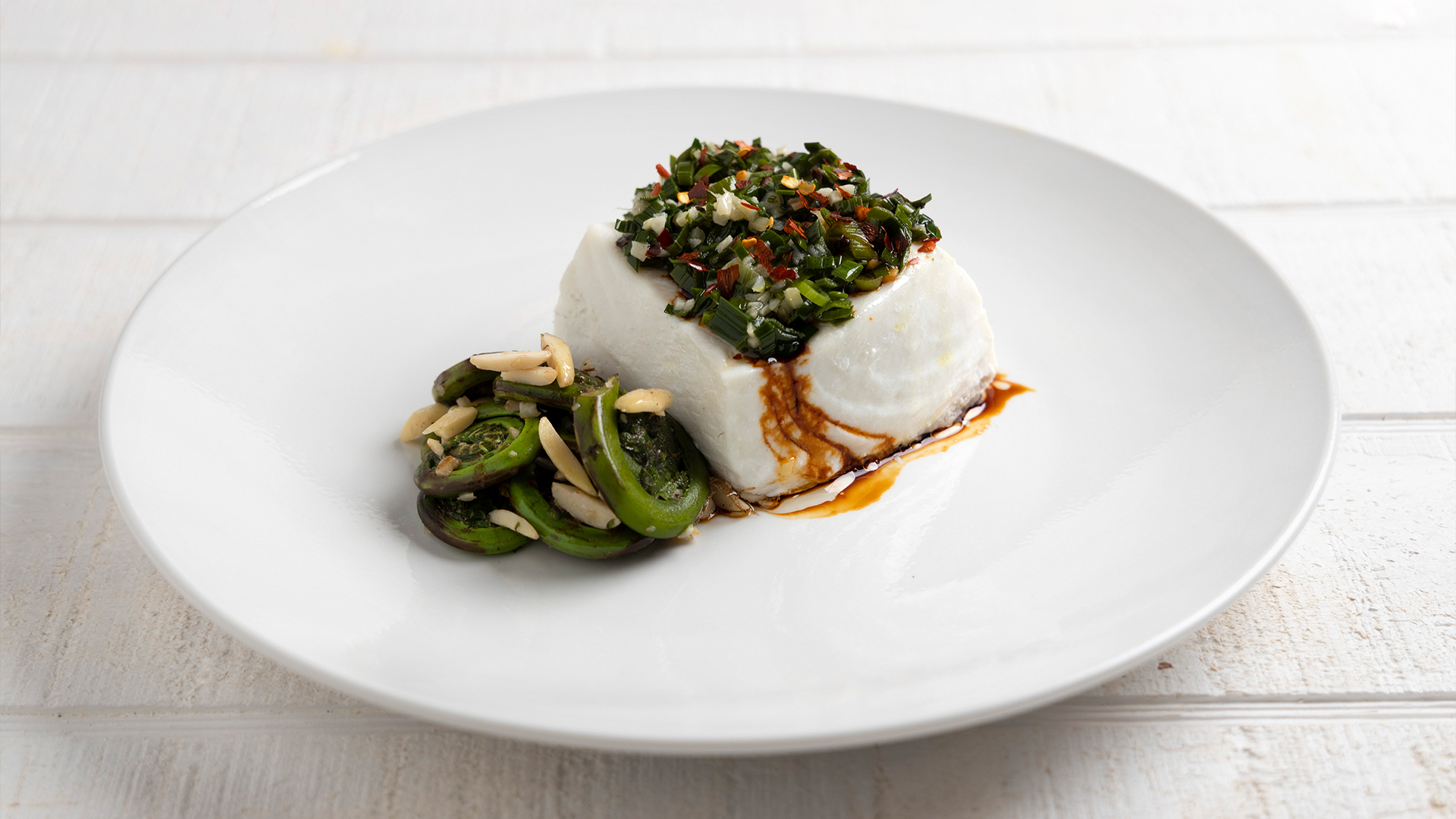 Steamed halibut with ramps and fiddleheads