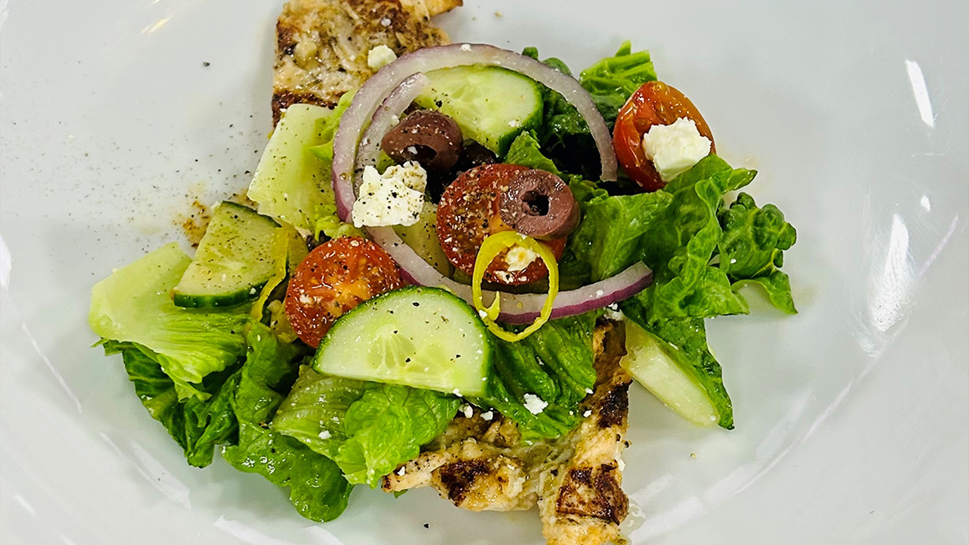 Grilled chicken paillard with Greek salad