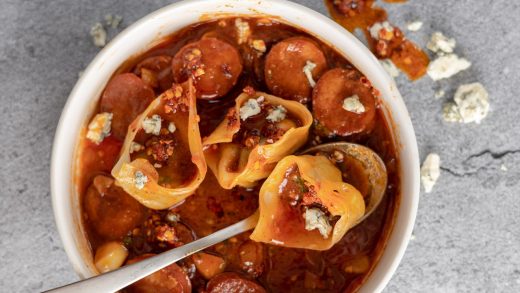 Spinach and cheese stuffed wontons with spicy chorizo