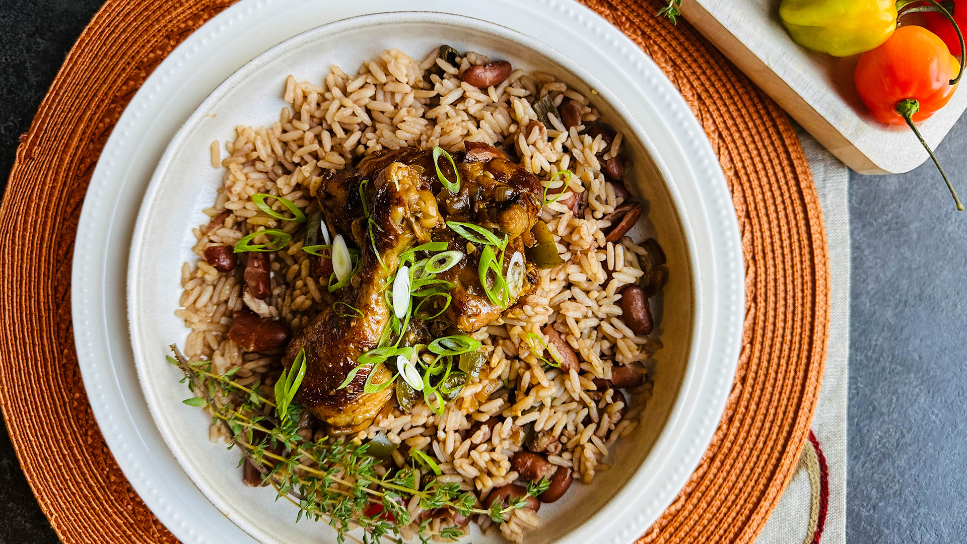 Brown stew chicken with rice and peas
