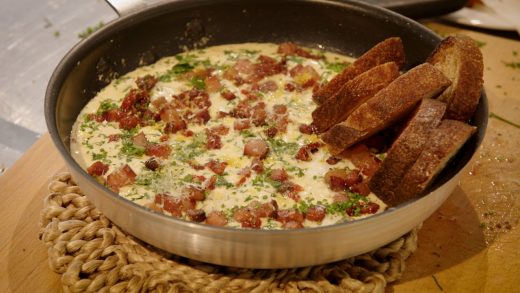 White shakshuka with guanciale and cheese