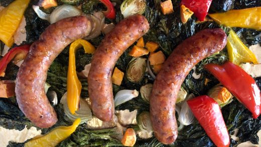 Roasted sausages, multi-coloured peppers, sweet potatoes and broccoli rabe