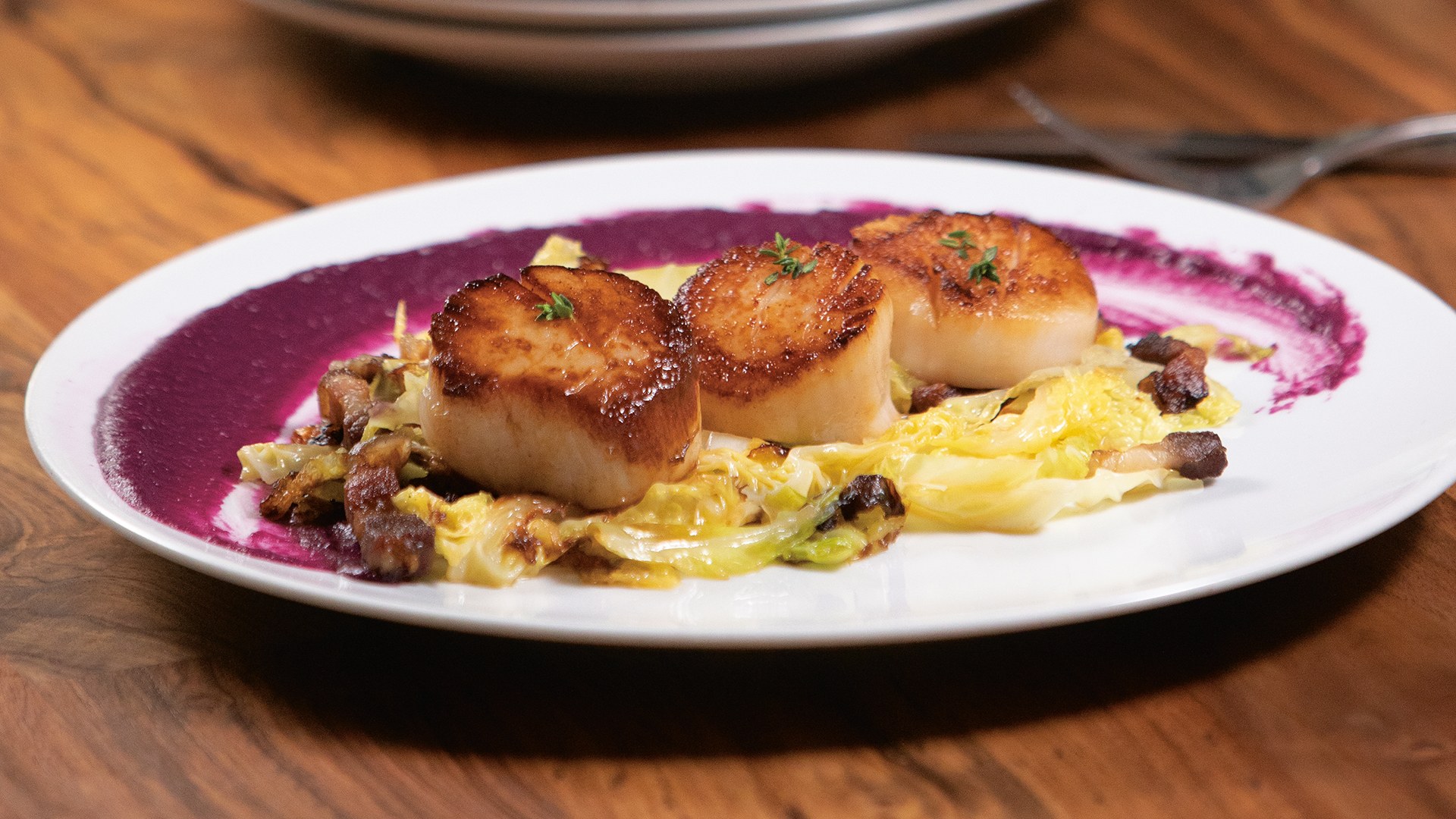 Seared scallops with bacon and cabbage