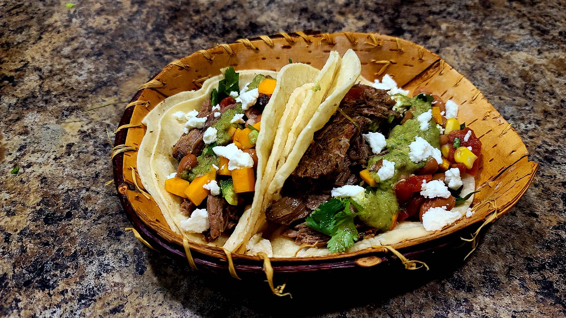 Navajo wild tea and herb braised goat tacos