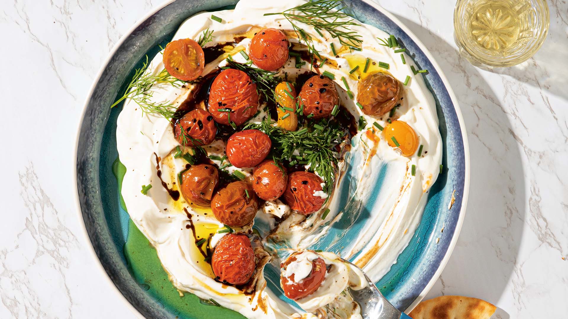 Labneh with bursted tomatoes and dill