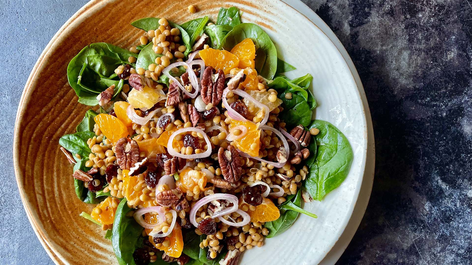Spinach and lentil salad with clementines and pecans