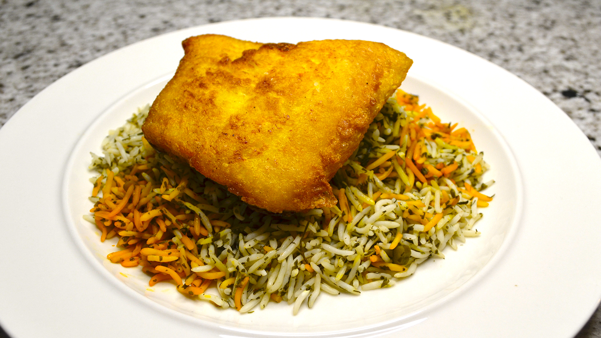 Banu's sabzi polo mahi (Herbed basmati rice with saffron whitefish)