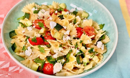 Farfalle with greens, cherry tomatoes and feta