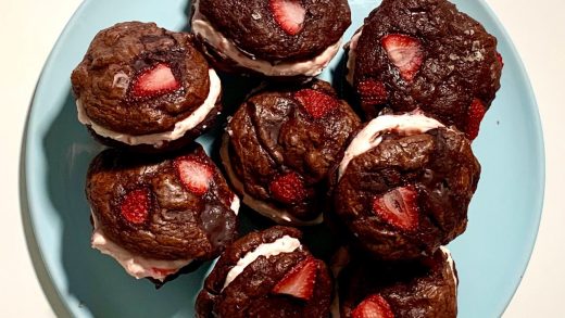 Double chocolate brownie cookie sandwiches with strawberry cheesecake filling