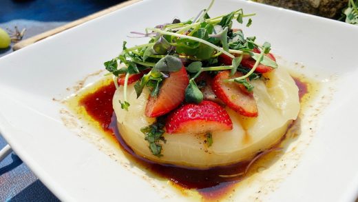 Pan seared provolone with mixed microgreens and Ontario strawberries