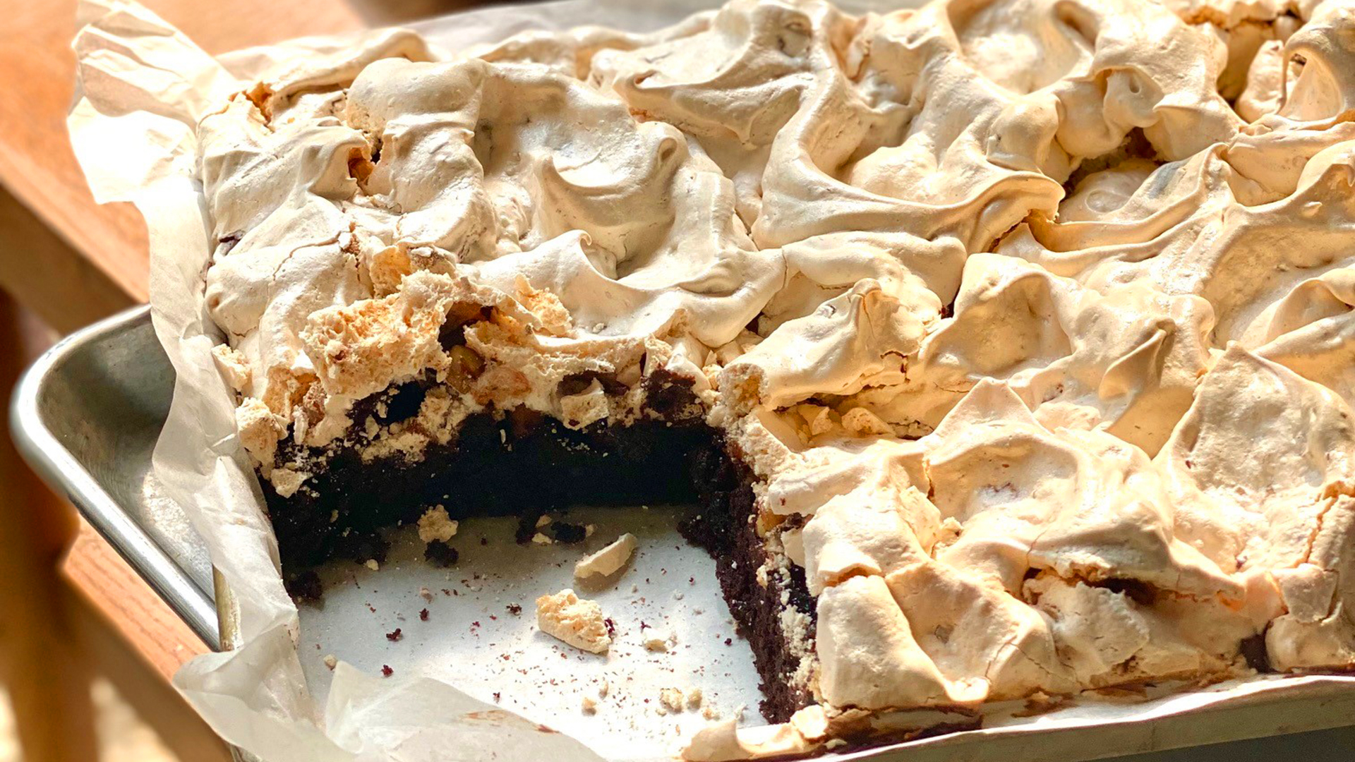 Brownie meringue cake with walnuts and chopped chocolate