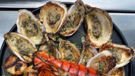 Grilled P.E.I. oysters with garlic asiago butter