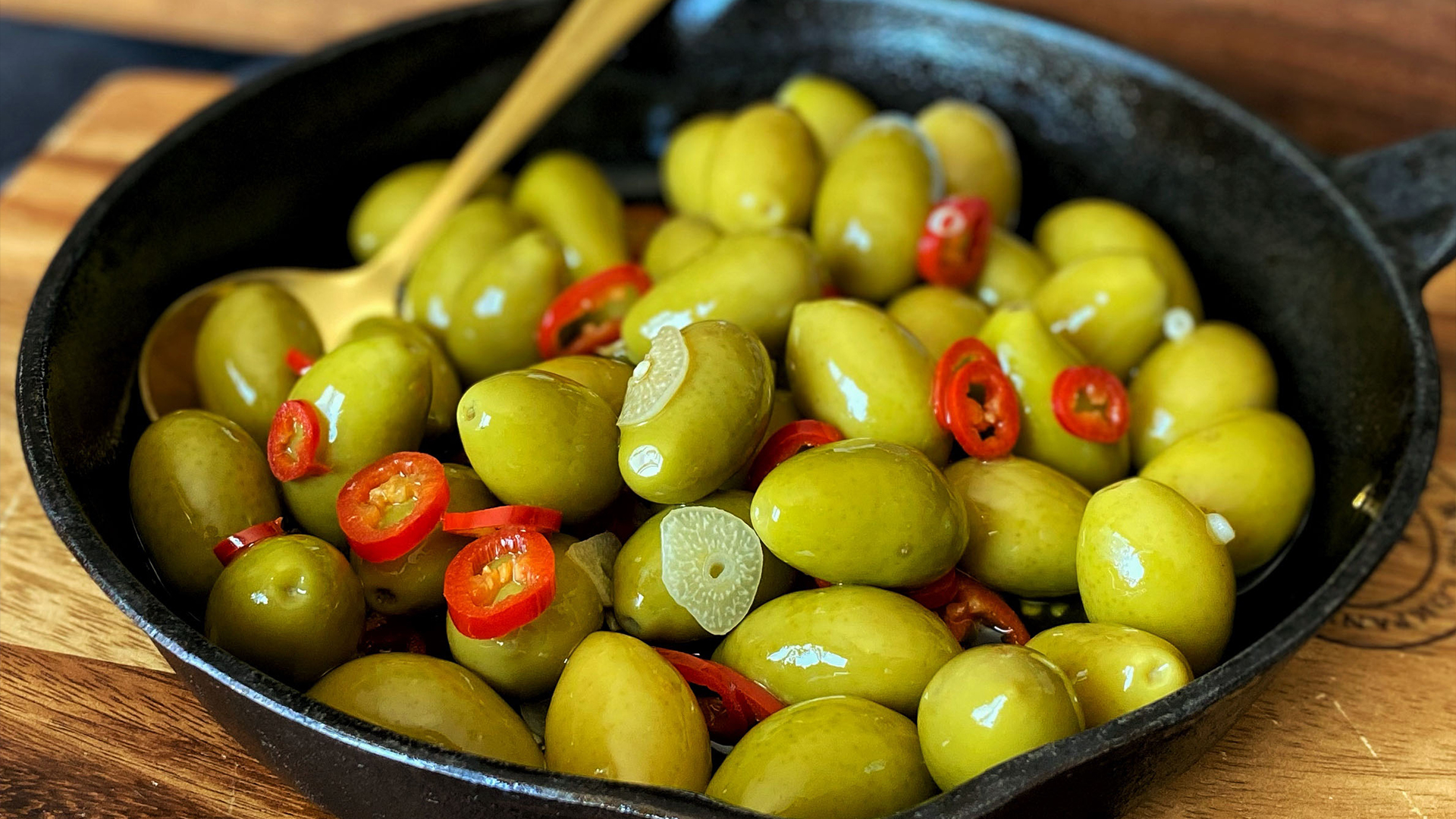 Warmed olives with garlic and chilli
