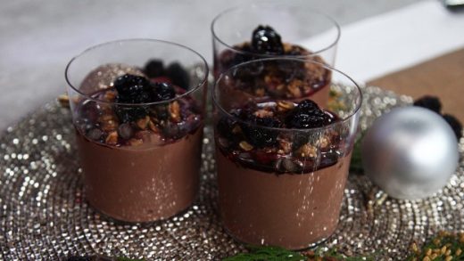 Chocolate yogurt granola bowl with cherry compote