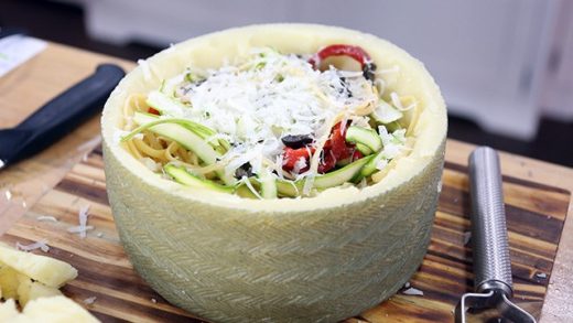 Asparagus &amp; piquillo pepper pasta in manchego cheese wheel