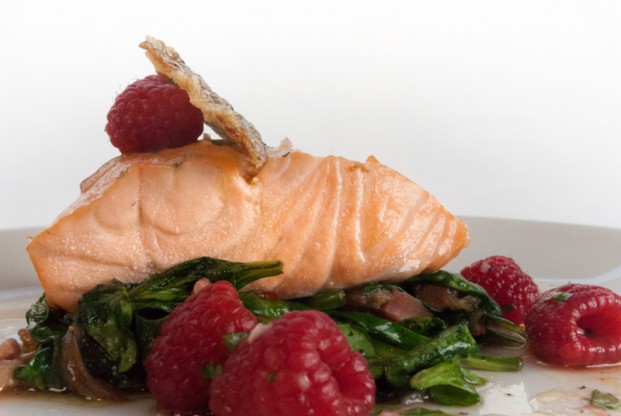Oil-poached Atlantic salmon with pancetta spinach salad and raspberry vinaigrette