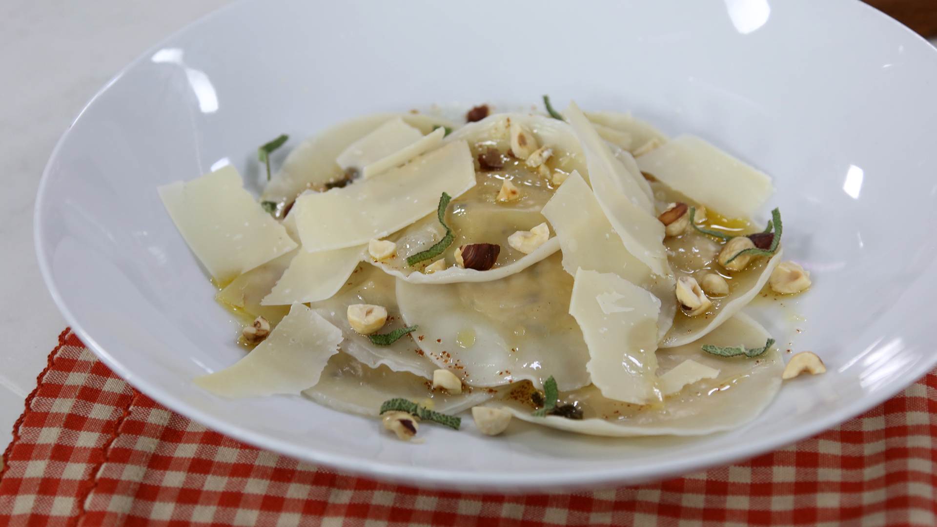 Roasted pumpkin ravioli with brown butter and hazelnuts
