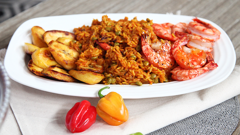 Jollof rice and peas with fried plantain