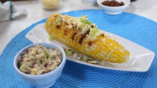 Grilled corn with bacon butter with aged Canadian cheddar and scallions