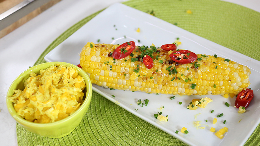 Grilled corn with mango butter with cayenne, spices and lime