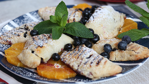Grilled berry turnovers with orange yogurt dipping sauce