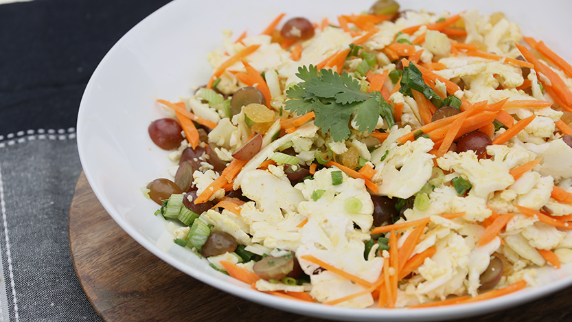 Cauliflower and carrot slaw with honey-curry vinaigrette