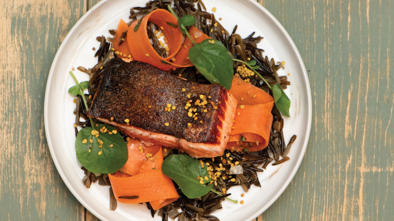 Seared salmon with pickled carrots, cracked wild rice, and bee pollen