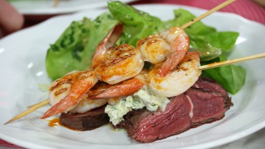 Steak and shrimp with blue cheese butter and salad