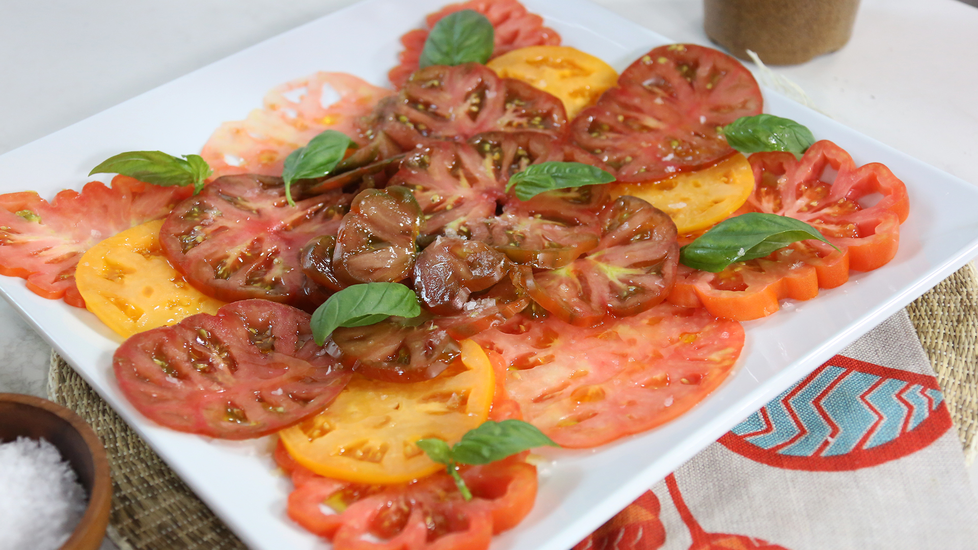 Heirloom red and yellow tomato carpaccio salad