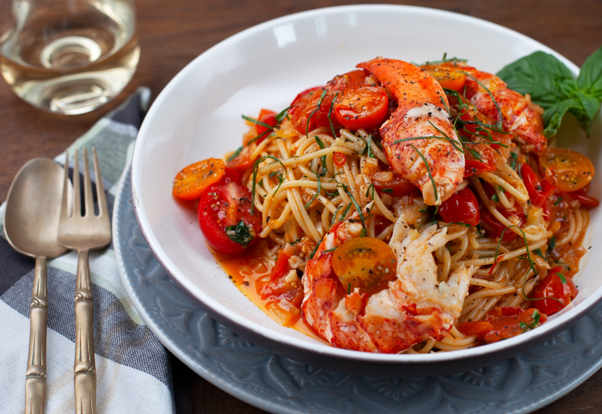 Lobster spaghetti with chili peppers, garlic, basil and tomatoes