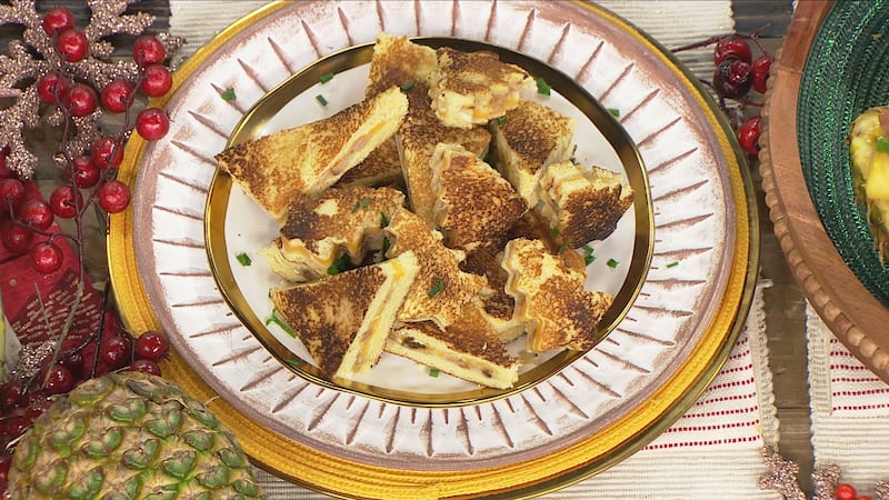 Grilled cheese sandwiches on a yellow-buttered bread in the shapes of triangles and Christmas trees