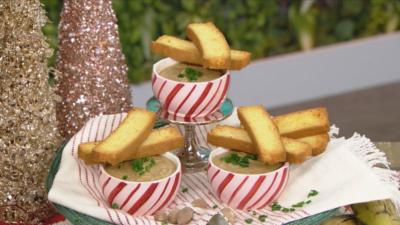 Biscotti-looking pieces of corn bread sitting criss-cross on red-and-white striped bowls (three bowls in total). The soup itself inside the bowls is a beige colour.